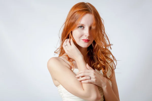 Beauty shot of a young blue eyed woman with her red hair — Stock Photo, Image