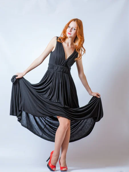 Redhead full body in black dress,studio shot — Stock Photo, Image