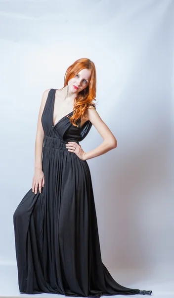 Redhead full body in black dress,studio shot — Stock Photo, Image