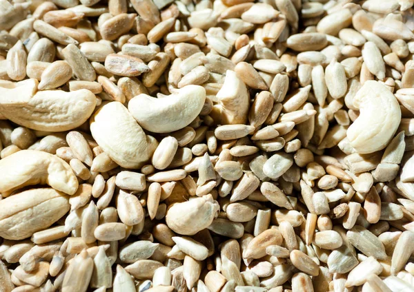 Nuts and seeds background — Stock Photo, Image