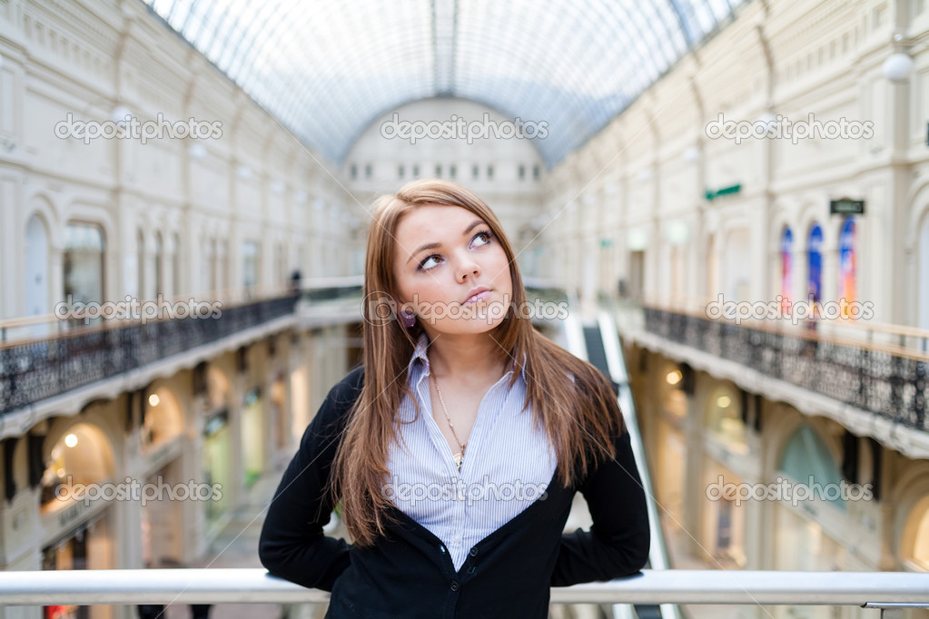 Photo of young beautiful lady inside the big mall