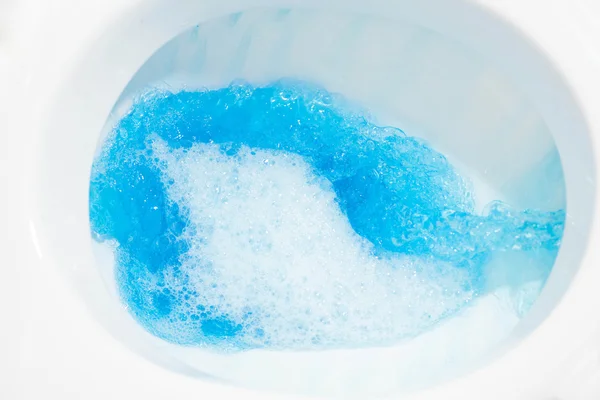 Toilet bowl closeup blue water — Stock Photo, Image