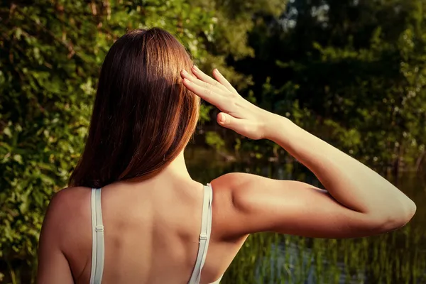 Back side of the female outdoors in summer time — Stock Photo, Image