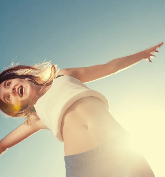 Blonde teenager girl jumping — Stock Photo, Image