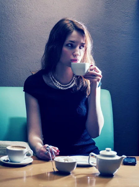 Women drinking cofee in loneliness — Stock Photo, Image
