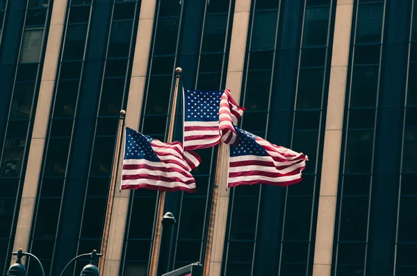 US flags against wall — Stock Photo, Image