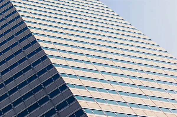 Blue sky reflecting in the windows — Stock Photo, Image