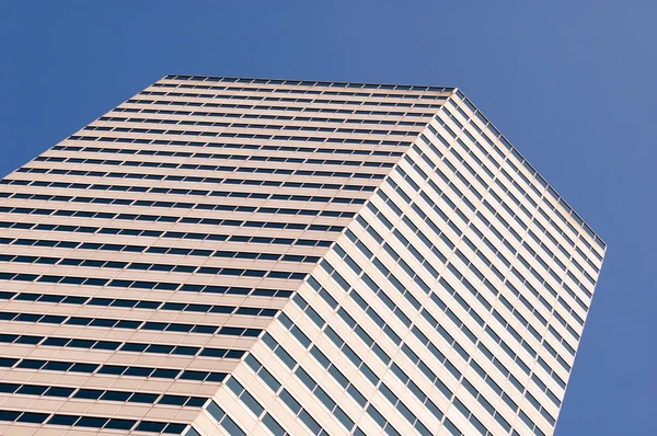 Blue sky reflecting in the windows — Stock Photo, Image