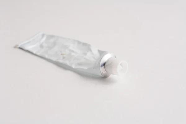Empty tube of glue — Stock Photo, Image
