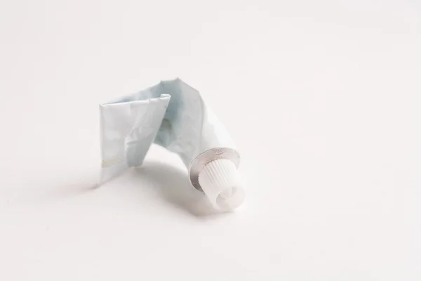 Crumpled tube of glue — Stock Photo, Image