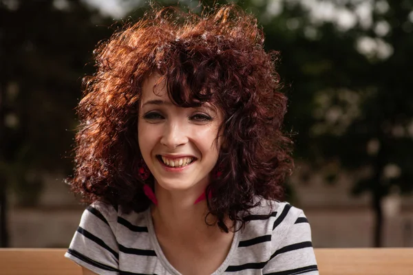 Portrait of beautiful smiling girl with curly red hair close up — Stock Photo, Image