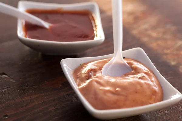 Two bowls of a delicious sauce on a table — Stock Photo, Image