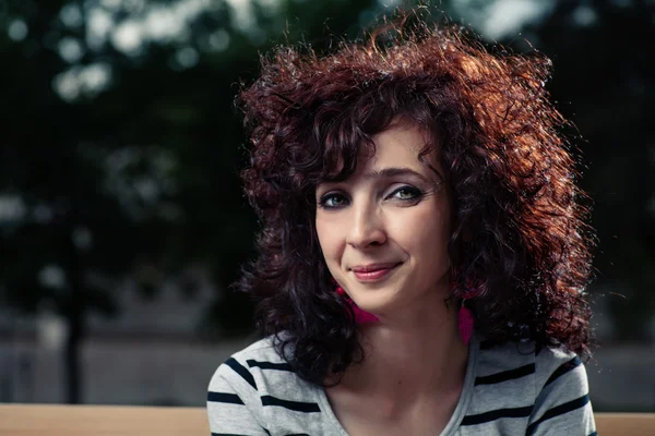 Smiling curly haired women