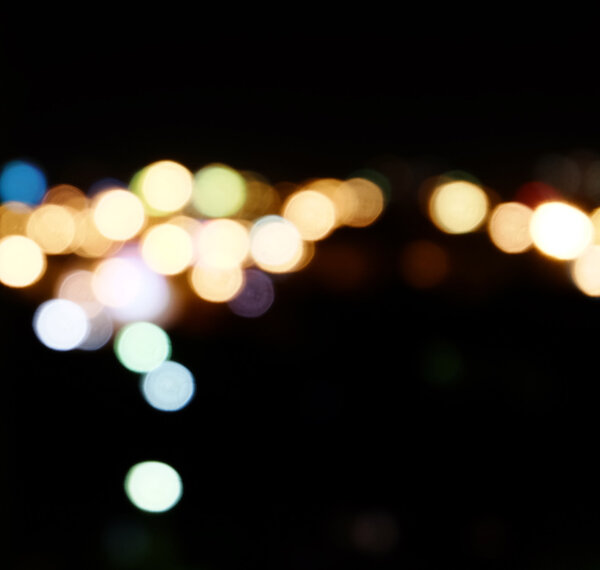City lights in the background with blurring spots of light a lot of copyspace.