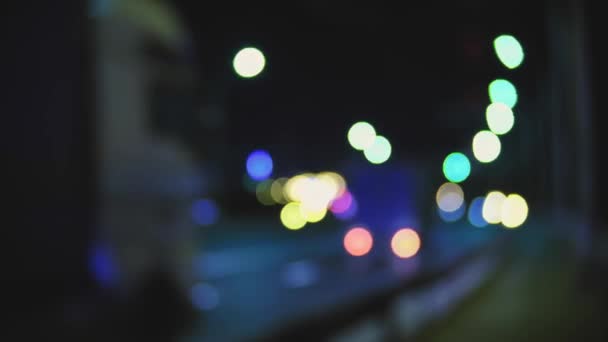 Blurred moving cars tail lights, bokeh traffic city overpass lights at night, abstract moving ovals lights — Stock Video