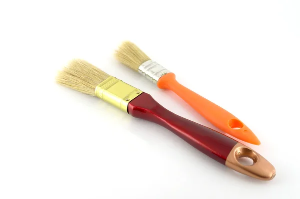 Paint brush with brown and orange handles — Stock Photo, Image