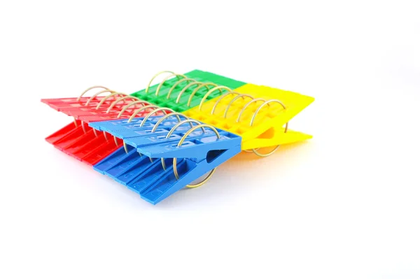 Color clothes-pegs over white — Stock Photo, Image