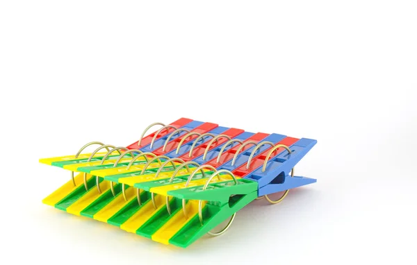 Color clothes-pegs over white — Stock Photo, Image