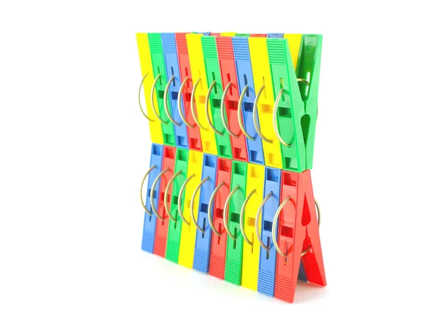 Color clothes-pegs over white — Stock Photo, Image