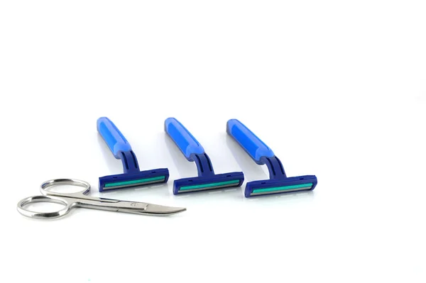 Three blue razors and scissors over white — Stock Photo, Image