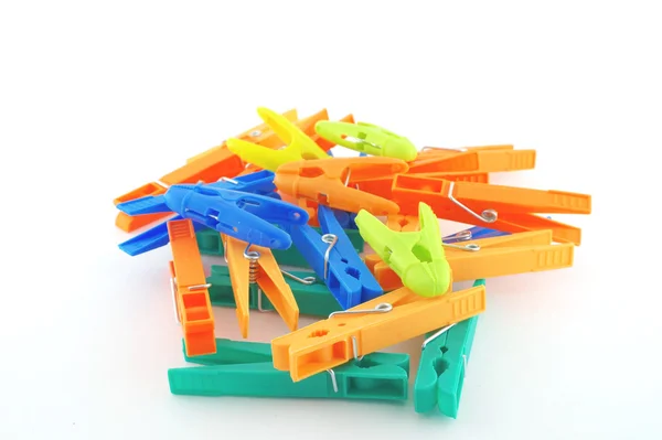 Color clothes-pegs over white — Stock Photo, Image