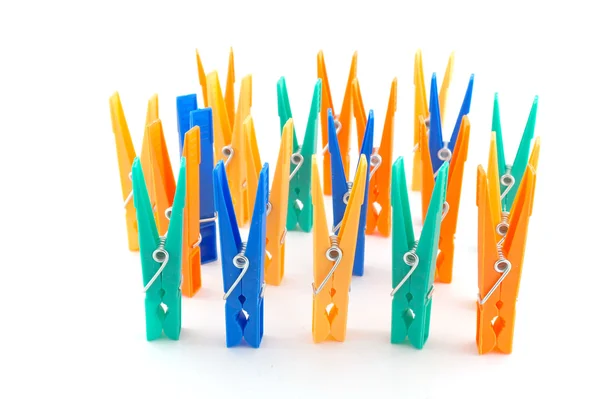 Color clothes-pegs over white — Stock Photo, Image