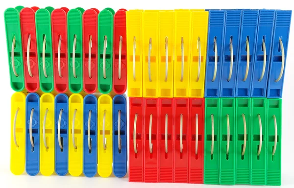 Color clothes-pegs over white — Stock Photo, Image