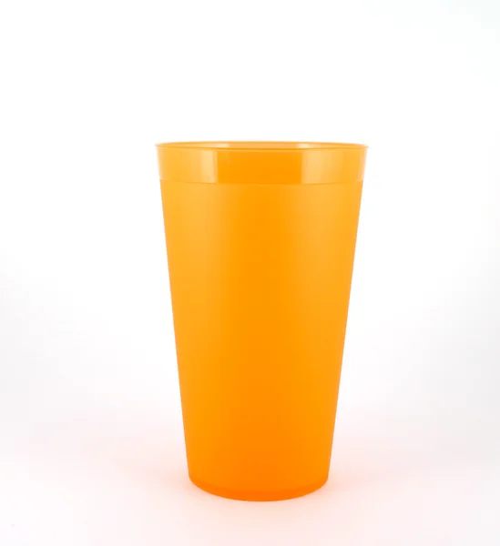 Orange plastic cup over white — Stock Photo, Image