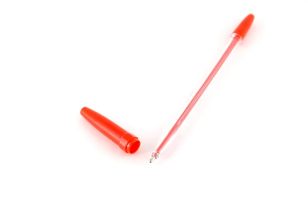 Czerwony długopis nad białym — Zdjęcie stockowe