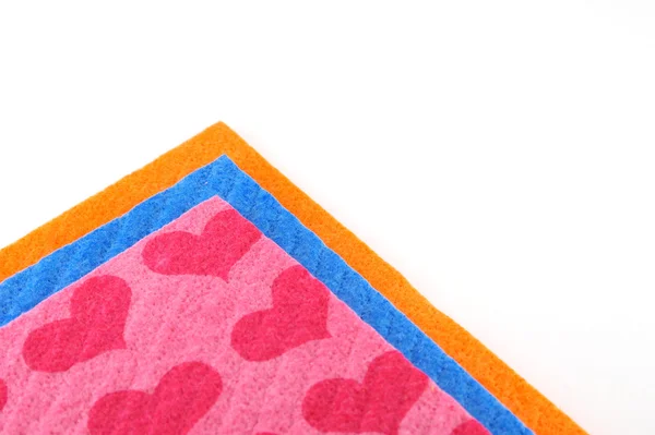 Orange, pink and blue napkins over white — Stock Photo, Image