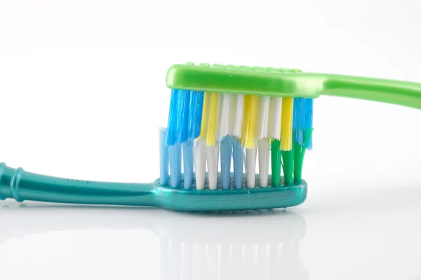 Two tooth-brushes over white — Stock Photo, Image