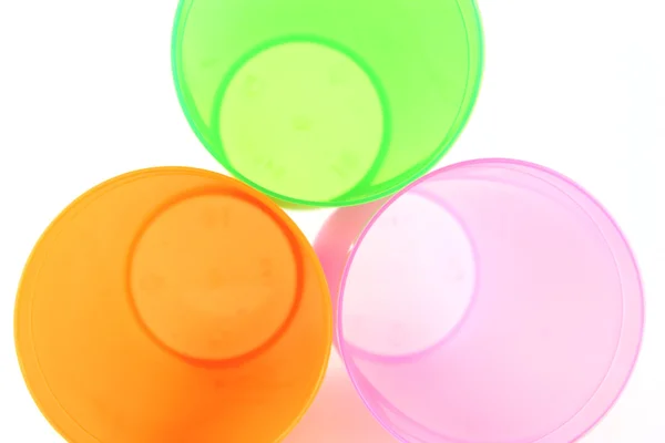 Green, orange and pink cups — Stock Photo, Image