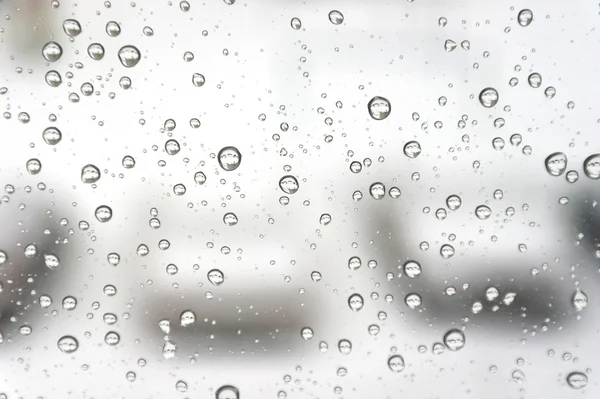 Drops of rain on the inclined window — Stock Photo, Image