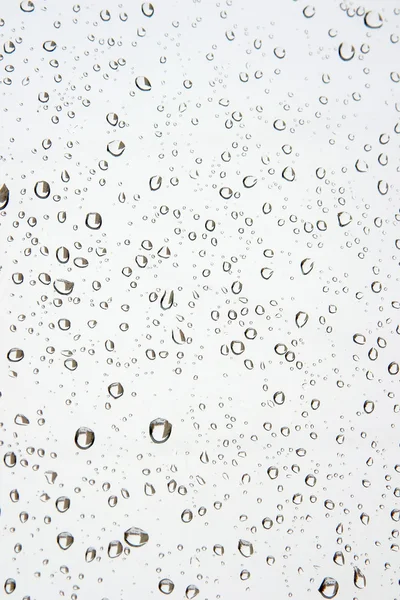 Gotas de agua en la ventana. Fondo abstracto — Foto de Stock