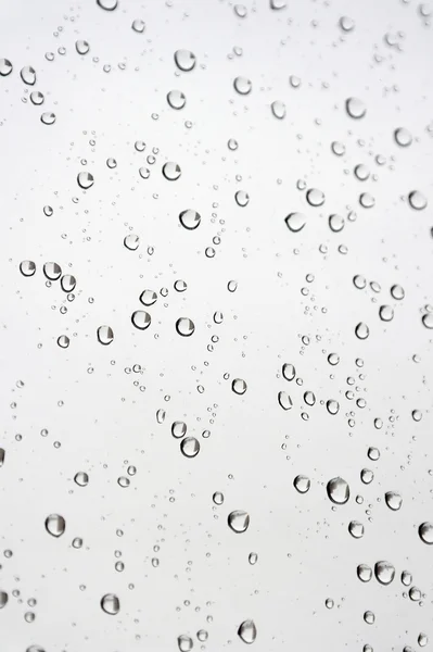 Drops of rain on the inclined window — Stock Photo, Image