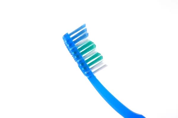 Зубная щетка на белом — стоковое фото