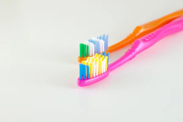 Two tooth-brushes over neutral — Stock Photo, Image