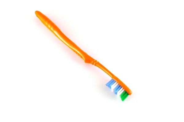 Orange toothbrush over white — Stock Photo, Image