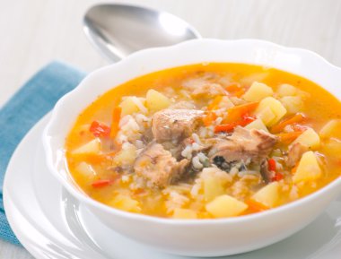 Fish soup with potato and rice clipart