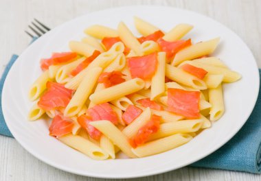 Pasta penne with smoked salmon clipart