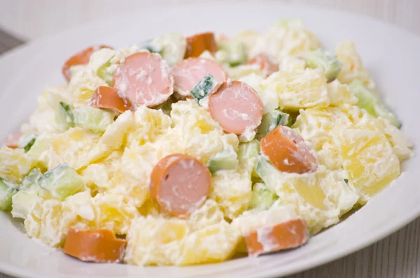 stock image salad made of potato, cucumber, onion with mayonnaise dressing