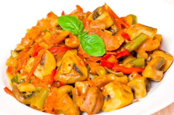 Meat with mushrooms and vegetables — Stock Photo, Image