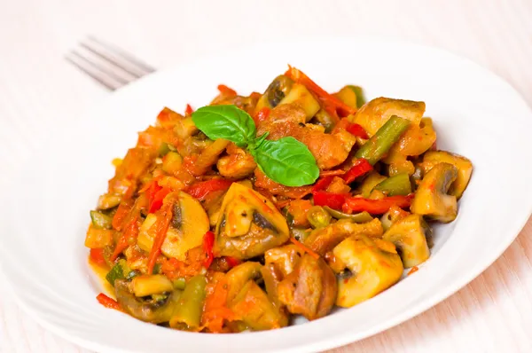 Meat with mushrooms and vegetables — Stock Photo, Image