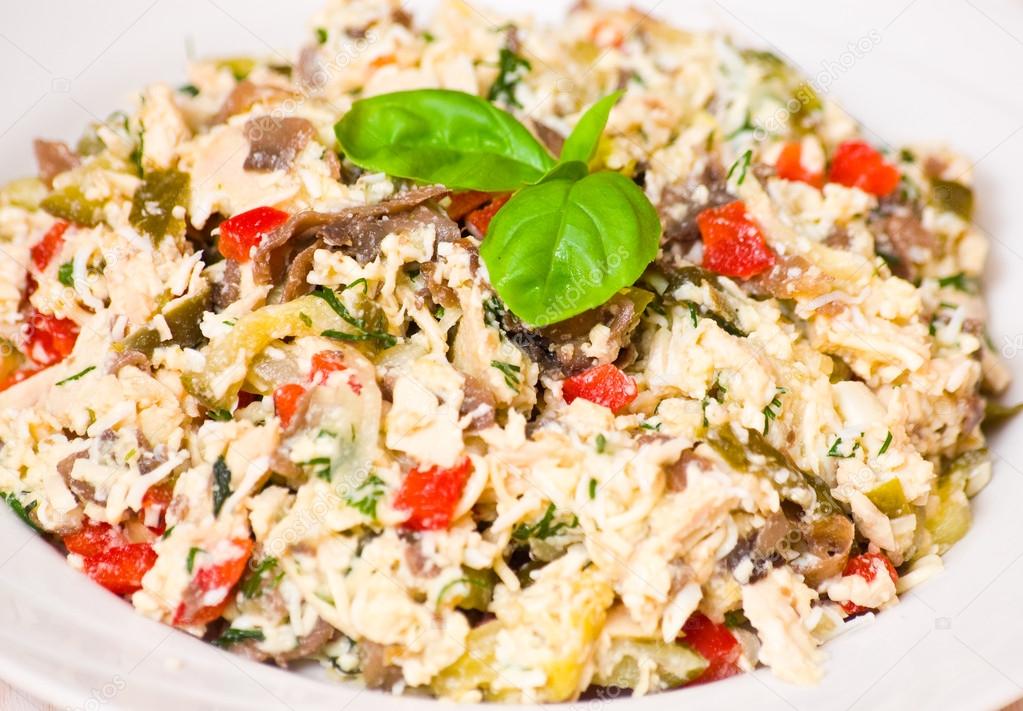 Salad with chicken, mushrooms, eggs, cheese, vegetables