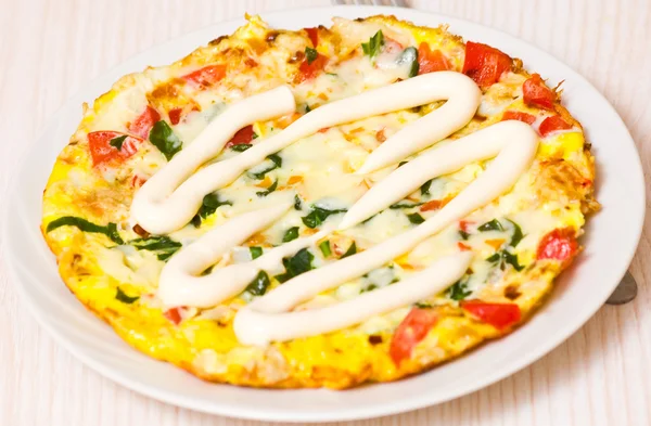 Omelette with vegetables and cheese — Stock Photo, Image