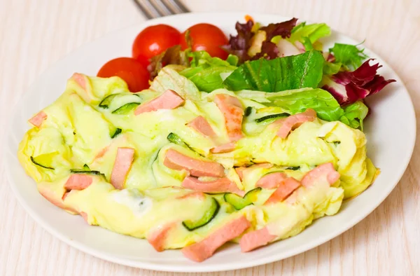 Omelet with ham and zucchini — Stock Photo, Image