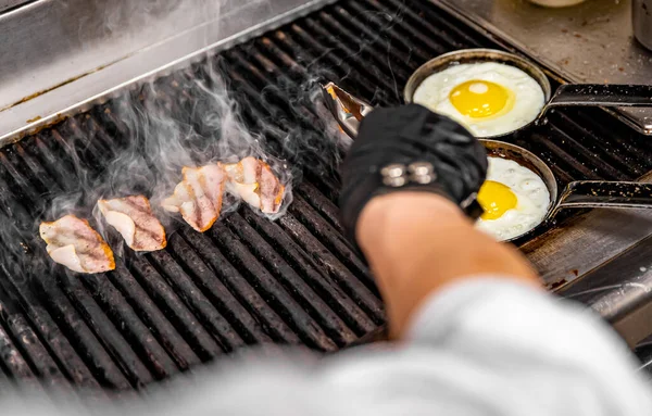 Chef Cooking Eggs Bacon Pan Grill Kitchen Stock Image