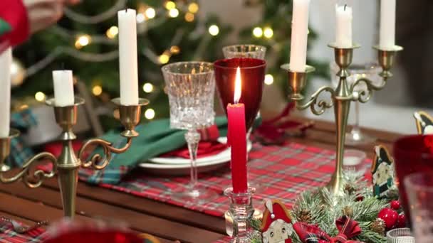 Close-up a female hand with a candle snuffer puts out candles — Stock Video