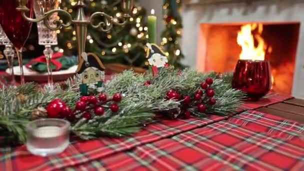 Festive New Years table on the background of a fireplace with fire — Stock Video