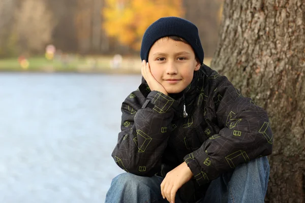 Boy relaxing in autumn — Stock Photo, Image